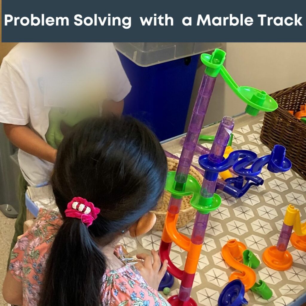 children playing with marble tower